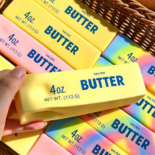 Pastel Butter Stick Squishy with a printed 4oz wrapper held in a hand