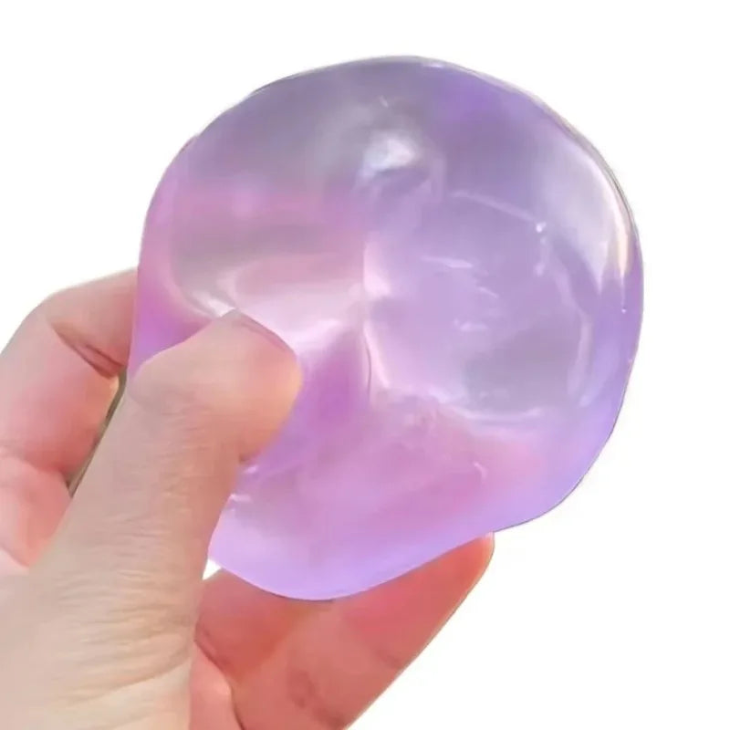Translucent purple mochi maltose squishy stretched between two hands