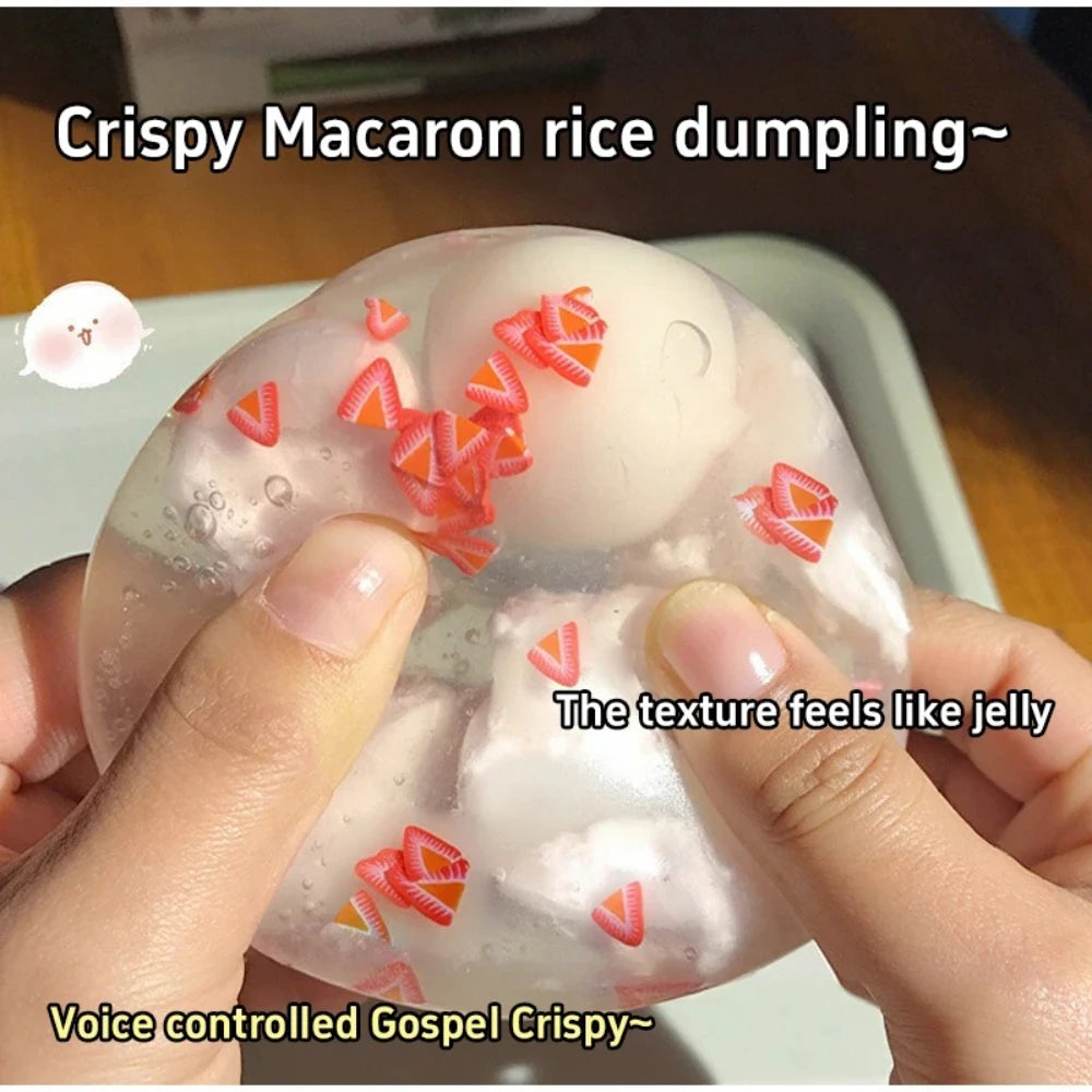 Translucent rice dumpling squishy with a crispy skin being pressed flat between two hands