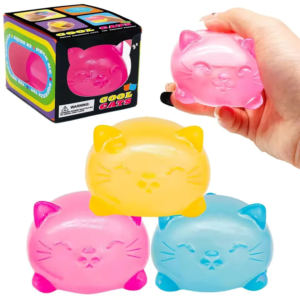 Cube-shaped cat maltose squishies in pink, yellow and blue with printed faces